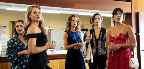 A group of five women in formal attire looking shocked A group of five women in formal attire looking shocked