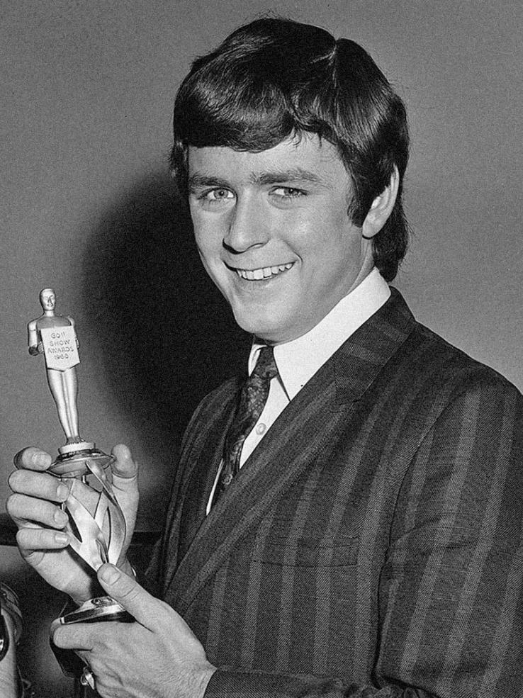 Entertainer Johnny Young, circa 1965, holding up a statuette that has Go!! Show Awards 1965 engraved on it..